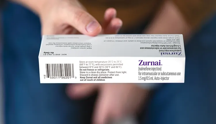 Hand holding the ZURNAI carton