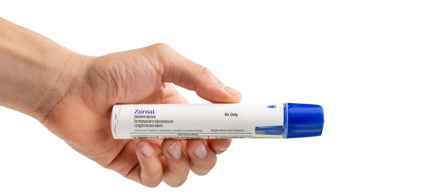 Male hand holding the ZURNAI auto-injector